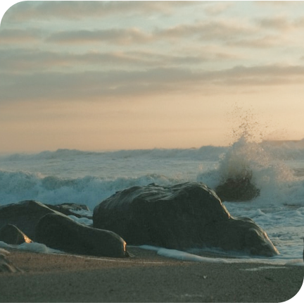 the sea crashing into rocks